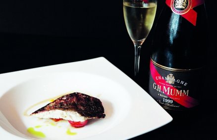 Seabass Fillet on a bed of seasonal vegetables monte in vanilla butter jus