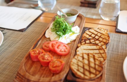 Burrata with fresh and semi-dried tomatoes with rocket pesto