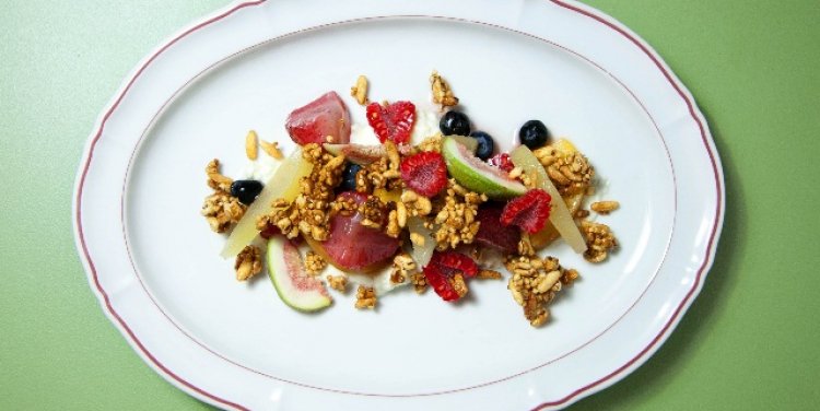 Puffed grains with poached fruits, fresh berries and lemon-infused mascarpone 
