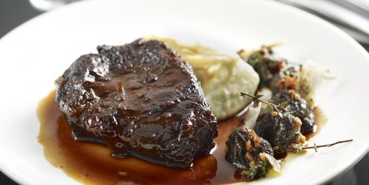Ox cheeks with smoked mash and persillade snails at Una, Singapore