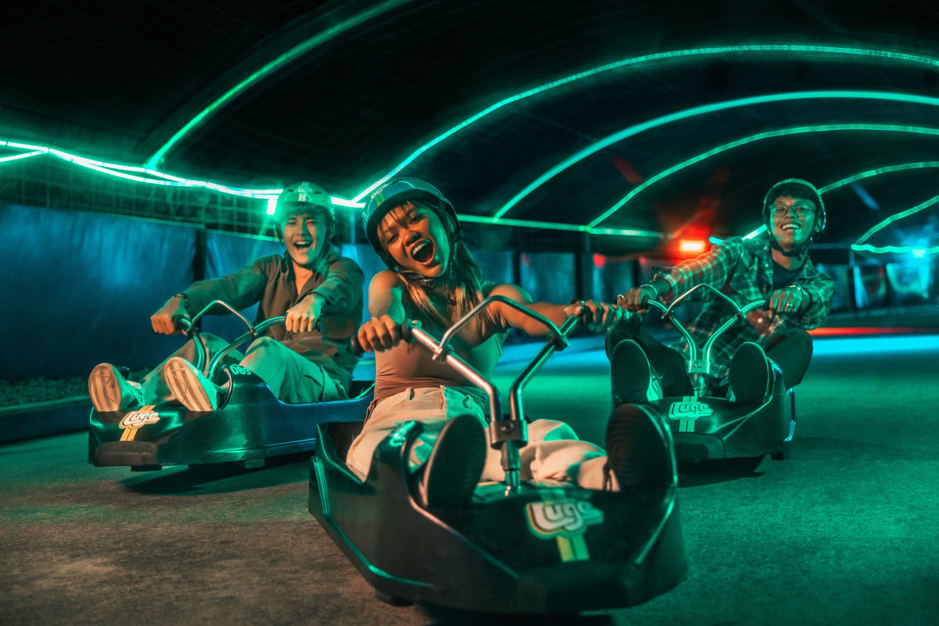, Go on a nighttime joyride with neon-lined tracks and energetic DJ sets at Skyline Luge Singapore