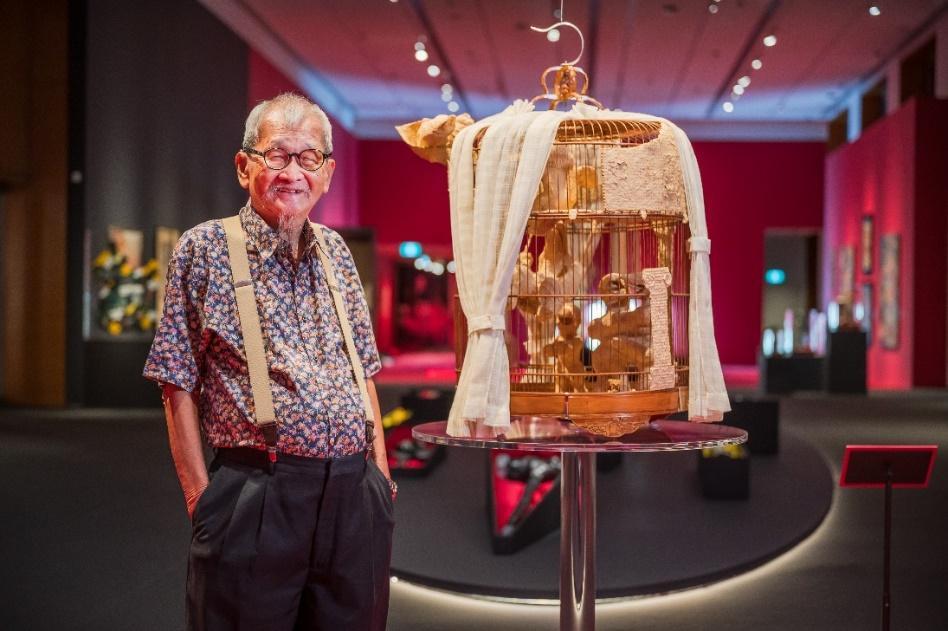 Artist Teo Eng Seng pictured with his artwork, We’re Happy. Are You Happy?, National Gallery Singapore, 2024